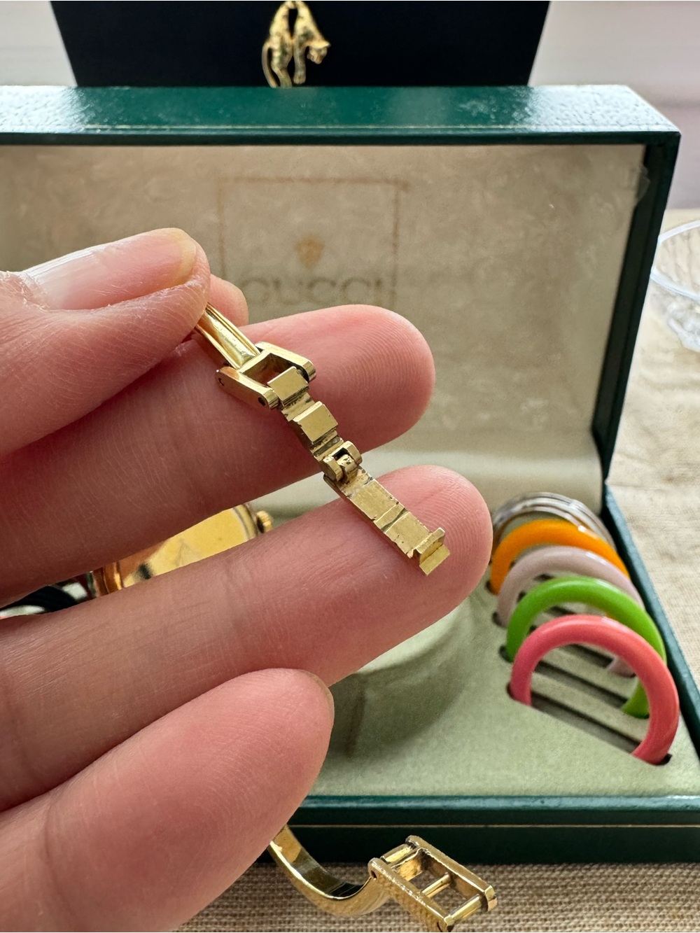Gucci Gold Bangle Watch with Interchangeable Multicolor Bezels - Picture 16 of 16